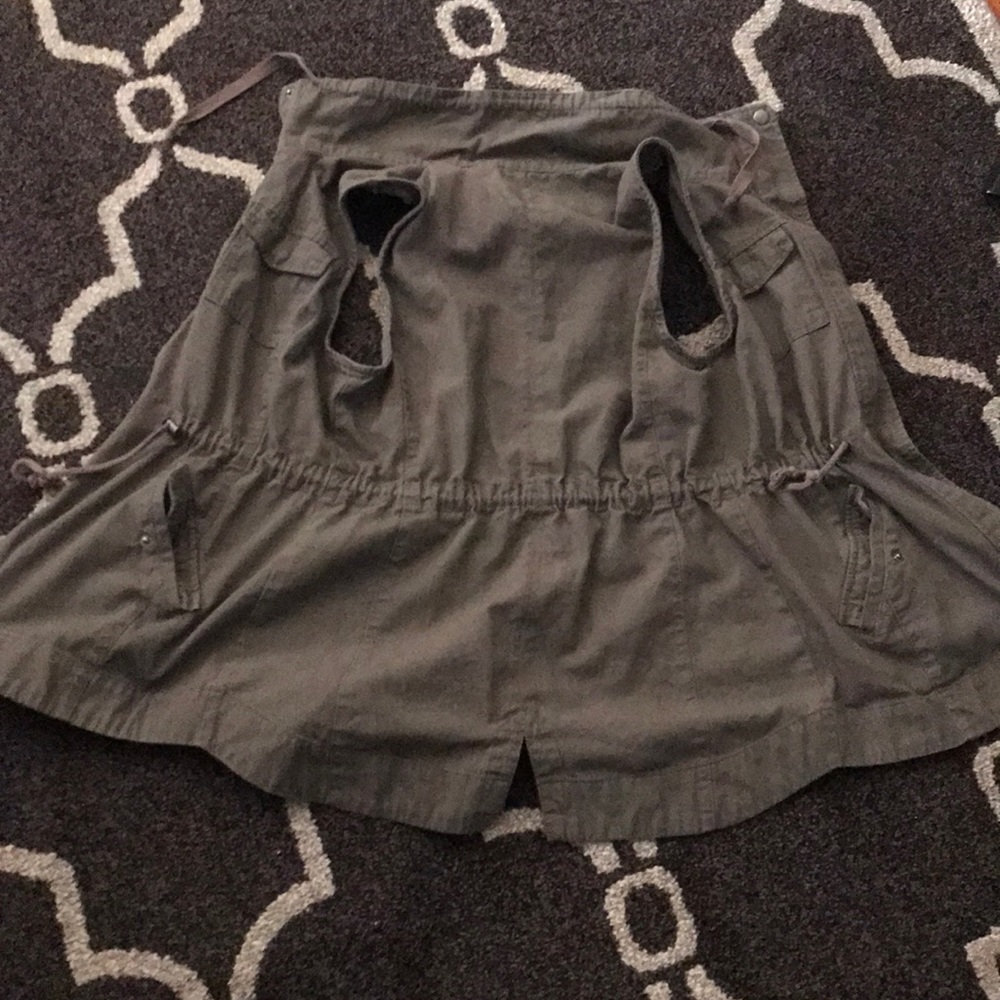 A green/brownish vest